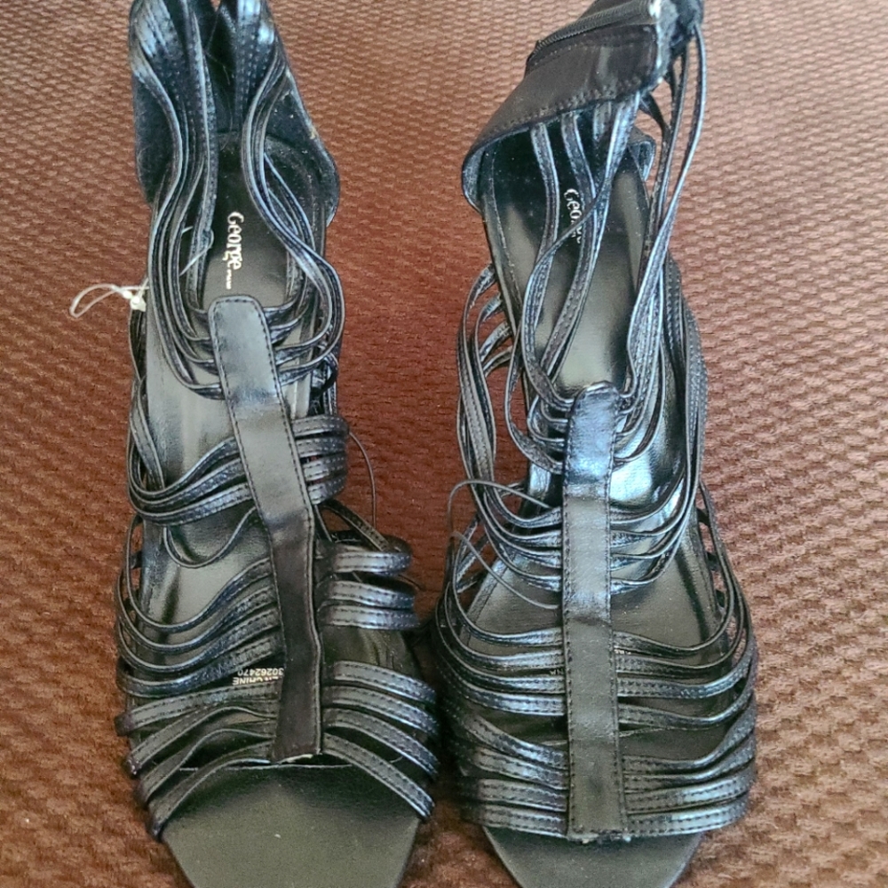 Heels. Black. Never worn. Just sat in my closet. Size 7. George brand.